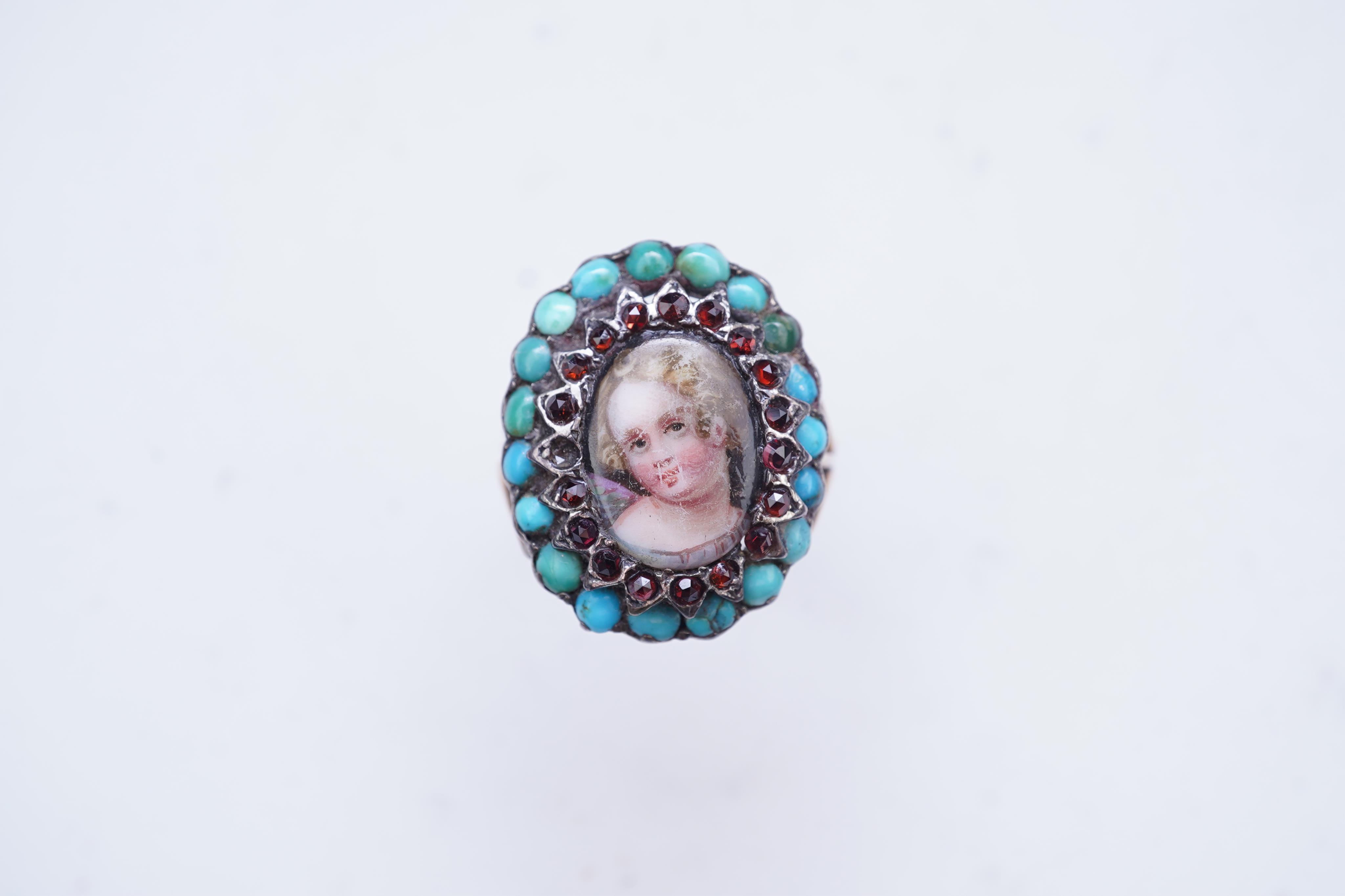 An enamel miniature, turquoise and garnet ring